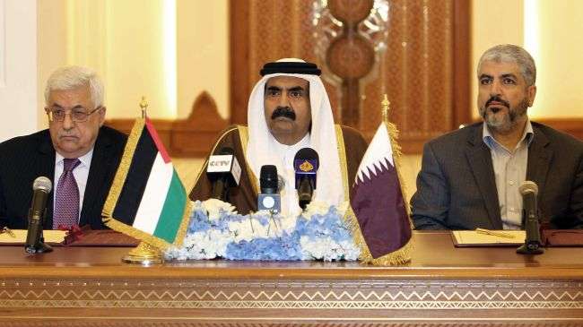 Qatari Emir Sheikh Hamad Bin Khalifa Al Thani (C), acting Palestinian Authority Chief Mahmoud Abbas (L) and Hamas Political Bureau chief Khaled Meshaal attend a meeting in Doha, February 6, 2012.