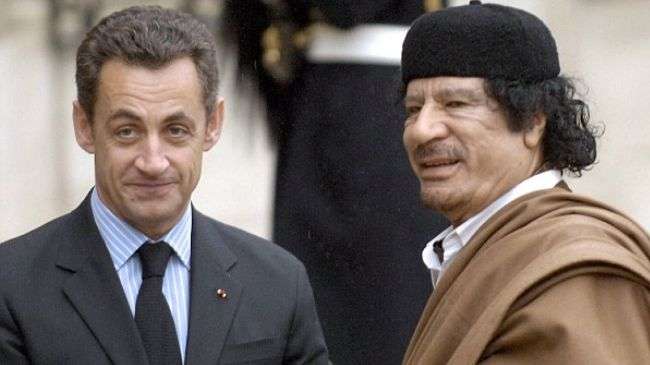 Slain Libyan dictator Muammar Gaddafi (R) and French President Nicolas Sarkozy (file photo)