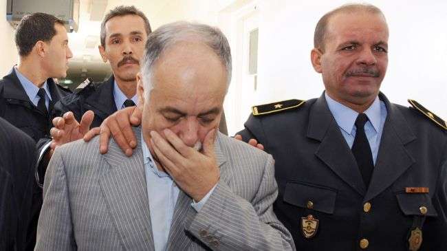 A file picture taken on November 8, 2011 shows Baghdadi al-Mahmoudi (L) upon arrival on at court in Tunis.