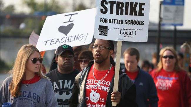 Striking Chicago public school teachers picket outside of George Westinghouse College Prep high school on September 17, 2012 in Chicago, Illinois.