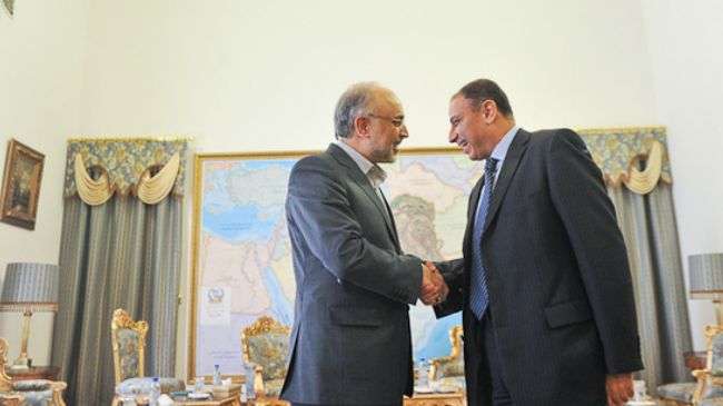 Iranian Foreign Minister Ali Akbar Salehi (L) welcomes the new head of Egyptian Interests Section in Tehran Khaled Emara, Tuesday, October 23, 2012.