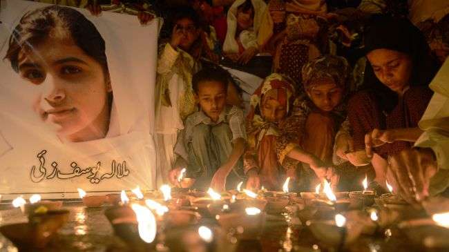 Pakistani children pray for the recovery of Malala Yousafzai, who was shot in the head by the Taliban militants, October 12, 2012.