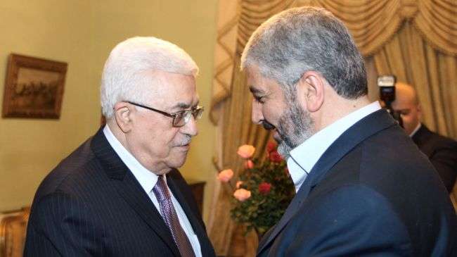 File photo shows a meeting between acting Palestinian Authority Chief Mahmoud Abbas from the Fatah party and Chairman of the Hamas Political Bureau Khaled Meshaal in Cairo.