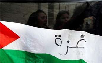 Demonstrators hold a Palestinian flag during a protest outside Jerusalem