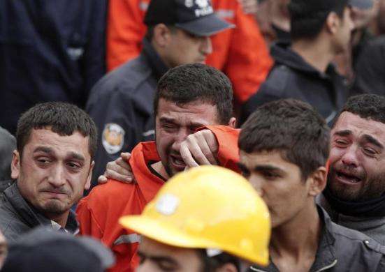 Relatives of miners who were killed or injured in a mine explosion react as rescuers work in Soma, a district in Turkey western province of Manisa May 14, 2014.