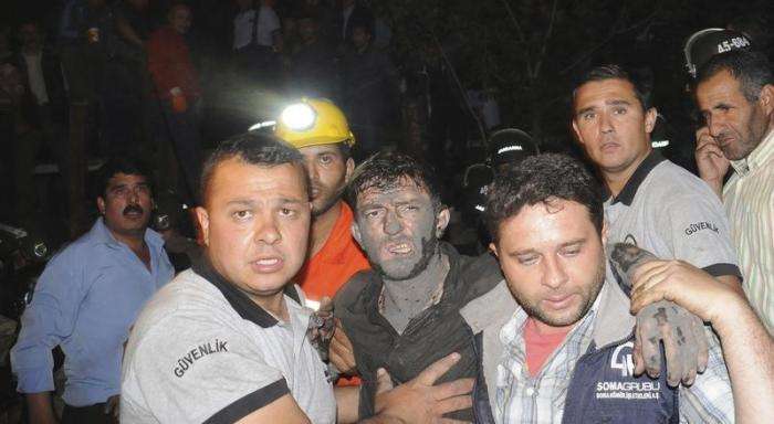 An injured miner is carried to an ambulance after an explosion and fire in a coal mine in Soma, a district in Turkey western province of Manisa May 13, 2014.