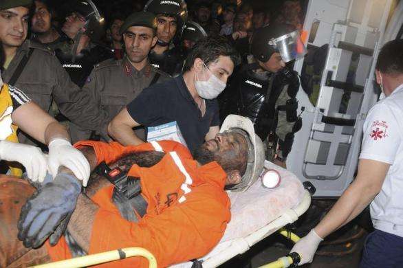 An injured miner is carried to an ambulance in Soma, a district in Turkey western province of Manisa May 13, 2014.