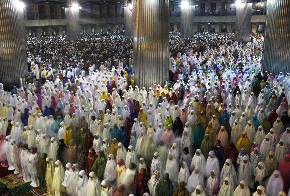 Muslims attend an evening mass prayer session called tarawih to mark the holy fasting month of Ramadan at Istiqlal Mosque in Jakarta June 28 2014.