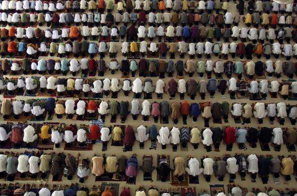 Students at an Islamic boarding school perform prayers at a mosque on the first day of the holy fasting month of Ramadan in Medan North Sumatra June 29 2014.