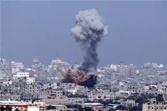 A picture taken from the southern Israeli-Gaza Strip border shows an explosion moments after an Israeli air strike on Gaza City, on July 11, 2014.
