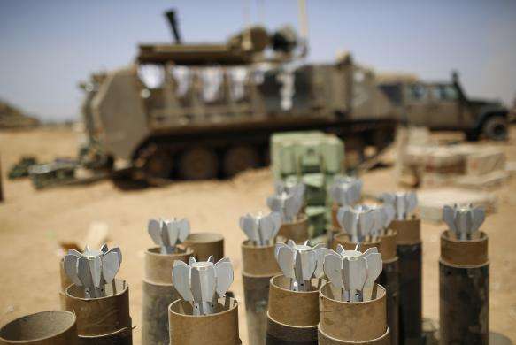 Mortar bombs are seen in containers at an Israeli military staging area near the border with Gaza July 30 2014.