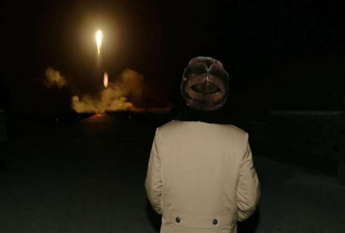 North Korean leader Kim Jong-un watching a ballistic missile launch drill in an undisclosed location
