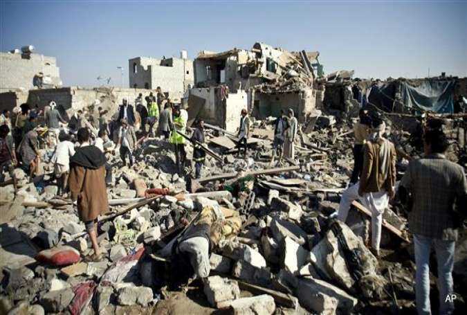People search for survivors under the rubble of houses destroyed by Saudi airstrikes near Sana