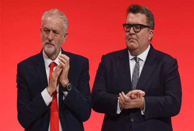 British Labour Party leader Jeremy Corbyn (L) and deputy leader Tom Watson.