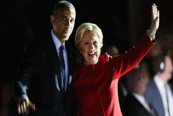 Democratic presidential nominee former Secretary of State Hillary Clinton stands with President Barack Obama during an election eve rally on November 7, 2016 in Philadelphia, Pennsylvania.
