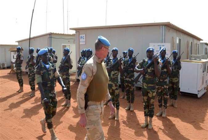Division General Jean-Paul Deconinck of the Belgian Army reviews UN troops as he arrives in Gao on April 13, 2017 to take command of the MINUSMA (United Nations Multidimensional Integrated Stabilization Mission in Mali). (Photo by AFP)