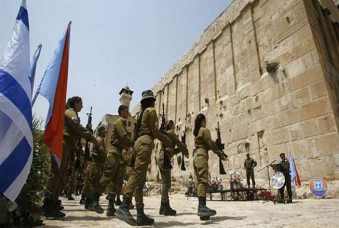 Israeli soldiers stand outside al-Khalil’s Tomb (Hebron) of the Patriarchs, also known as the Ibrahimi Mosque, a holy shrine for Jews and Muslims, on July 12, 2017.