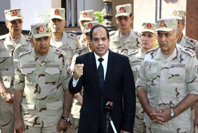 Egyptian President Abdel-Fattah El-Sisi (C) gives a speech during the press release following the meeting of the National Defense Council
