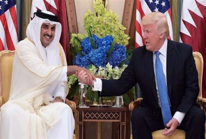 This picture taken on May 21, 2017 shows US President Donald Trump (R) shaking hands with Qatar