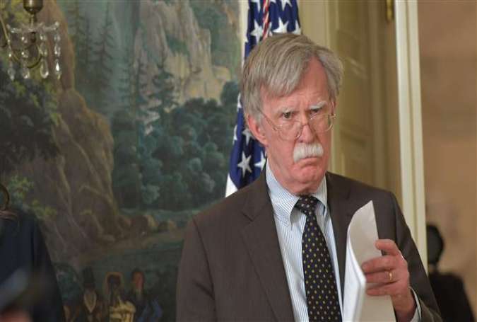 US National Security Adviser John Bolton listens as President Donald Trump (not seen) speaks on April 13, 2018 at the White House in Washington, DC. (Photo by AFP)