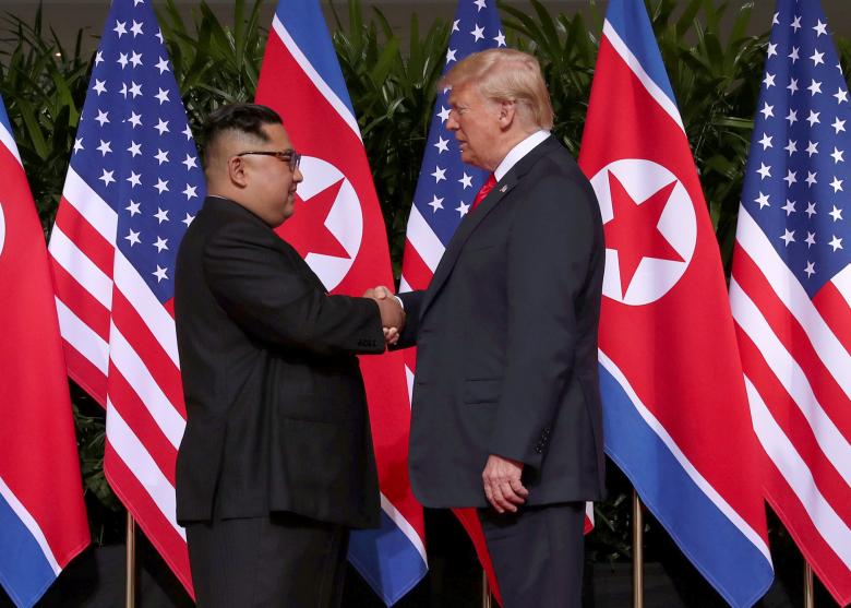 President Donald Trump shakes hands with North Korean leader Kim Jong Un at the Capella Hotel on Sentosa island in Singapore June 12, 2018.