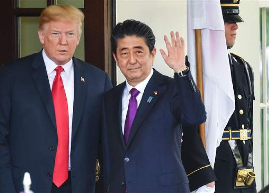 US President Donald Trump greets Japanese Prime Minister Shinzo Abe at the White House