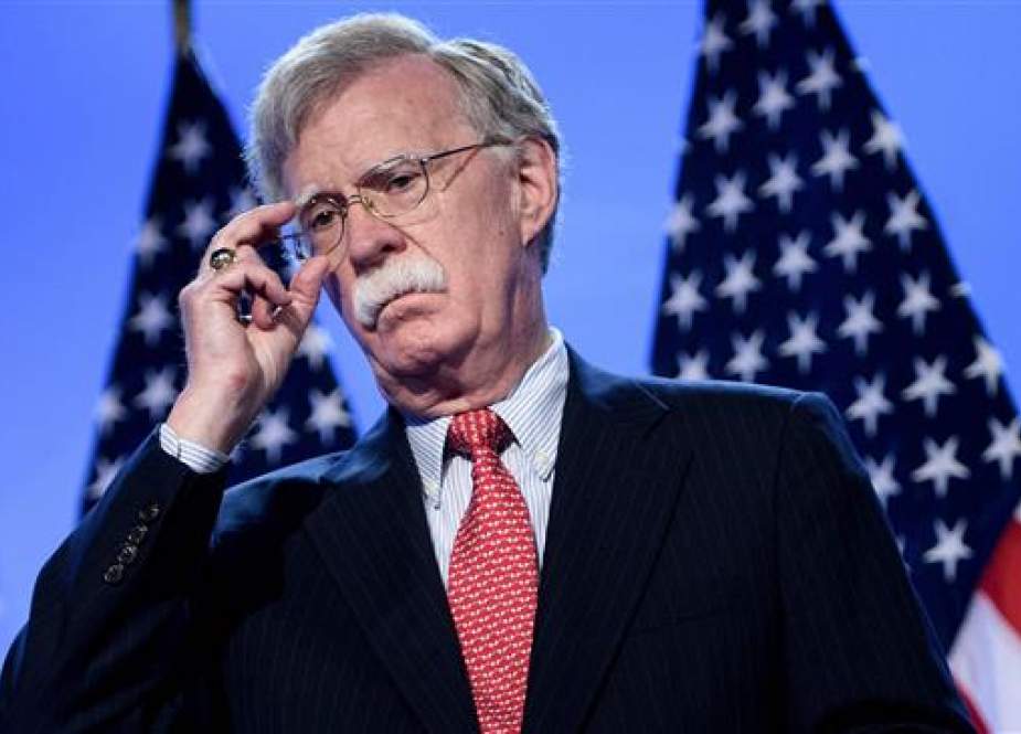 US National Security Adviser John Bolton looks on as US President Donald Trump (not pictured) addresses a press conference on the second day of the NATO summit in Brussels on July 12, 2018. (Photo by AFP)
