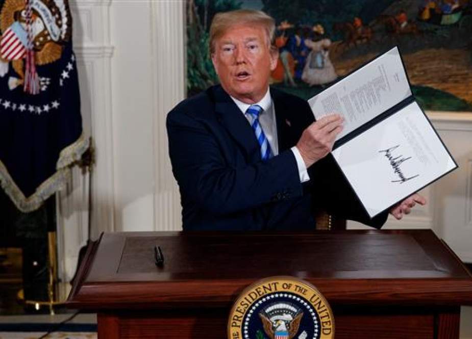 Donald Trump shows a signed Presidential Memorandum
