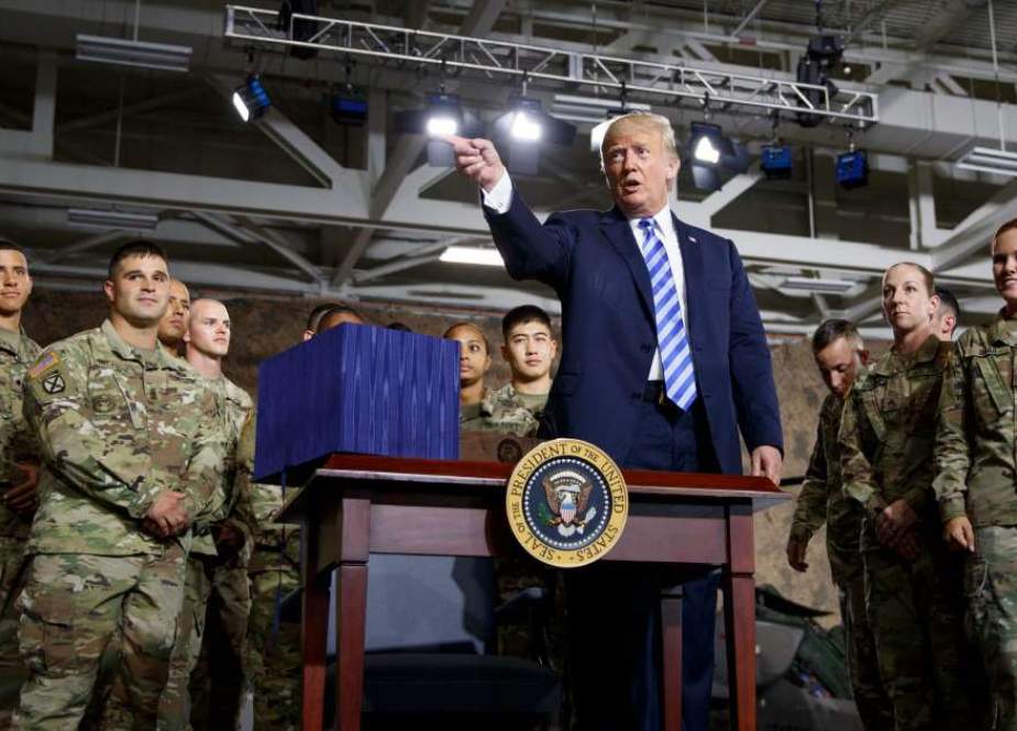 US President Donald Trump speaks during a signing ceremony for the “John S. McCain National Defense Authorization Act for Fiscal Year 2019” at Fort Drum, New York, on August 13, 2018. (Photo by AFP)