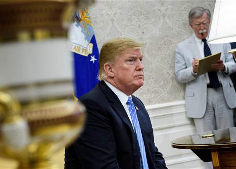 US President Donald Trump (L) and National Security Adviser John Bolton wait for a meeting with Dutch Prime Minister Mark Rutte in the Oval Office of the White House on July 2, 2018 in Washington, DC. (AFP photo)
