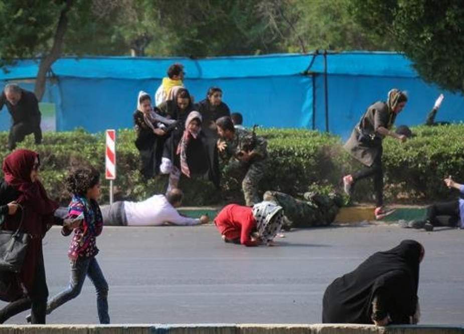People take cover as terrorists attack a military parade in Iran