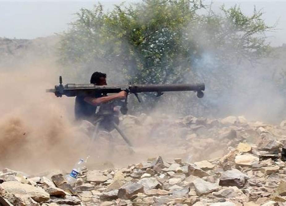 A militant recruited by the Saudi Arabia-led coalition invading Yemen fires a recoilless rocket launcher weapon as he and his fellow militants wage violence on the frontline of Kirsh between the provinces of Ta’izz and Lahij, southwestern Yemen, July 1, 2018. (Photo by AFP)