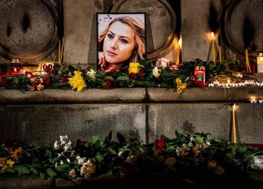 A portrait of slain Bulgarian television journalist Viktoria Marinova is seen during a candle-light vigil in the city of Rousse, Bulgaria, on October 8, 2018. (Photo by AFP)