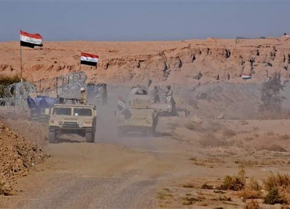 Iraqi forces gather near the al-Qa