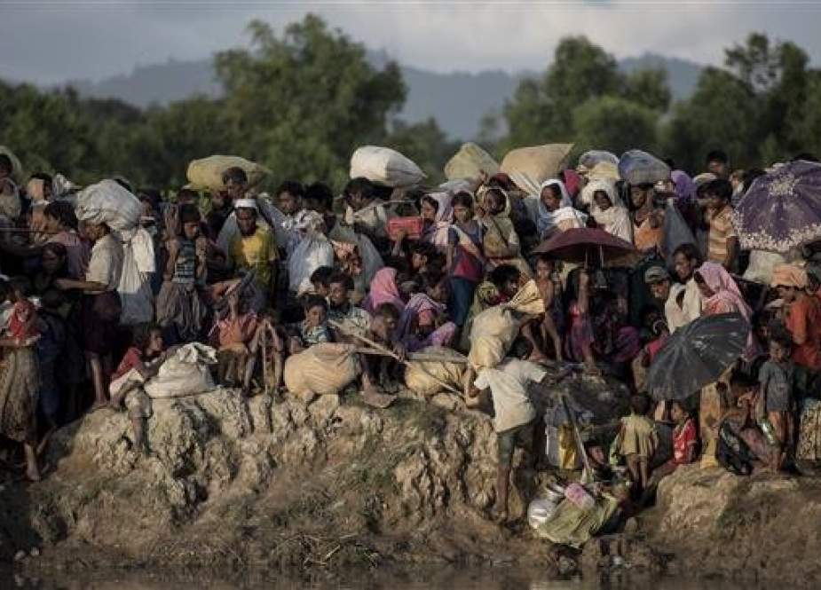 Rohingya refugees fleeing from Myanmar arrive at the Naf river in Whaikyang, Bangladesh border..jpg