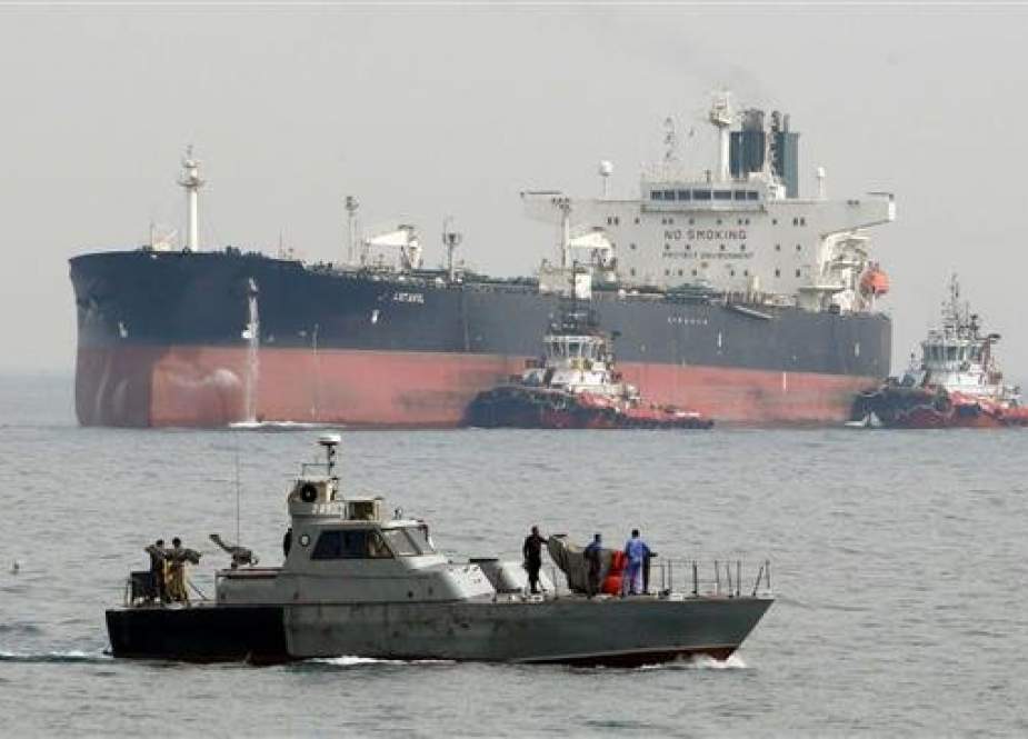 Iranian oil tanker NITC Artavil prepares to dock at Kharg Island in the Persian Gulf as Iranian coast guards patrol the waters. (File photo)