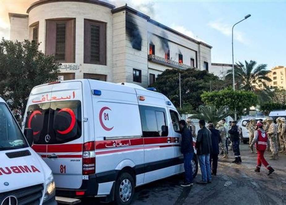 A picture taken on December 25, 2018 shows ambulances, paramedics, and security officers at the scene of an attack outside the Libyan foreign ministry headquarters in the capital Tripoli. (AFP)
