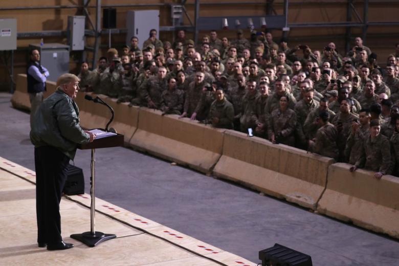President Donald Trump delivers remarks to U.S. troops in an unannounced visit to Al Asad Air Base, Iraq.