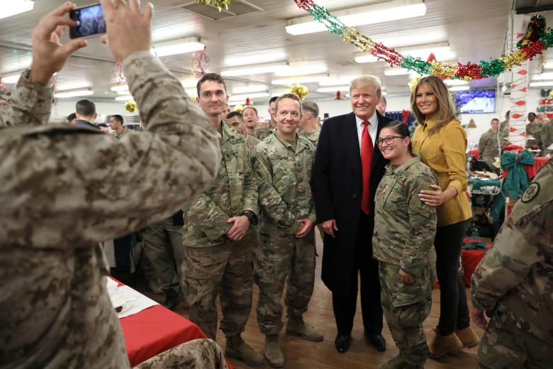President Donald Trump and First Lady Melania Trump greet military personnel at the dining facility during an unannounced visit to Al Asad Air Base, Iraq.
