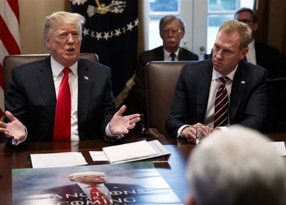 Acting Secretary of Defense Patrick Shanahan (R) listens as President Donald Trump speaks during a cabinet meeting at the White House on January 2, 2019, in Washington. (Photo by AP)