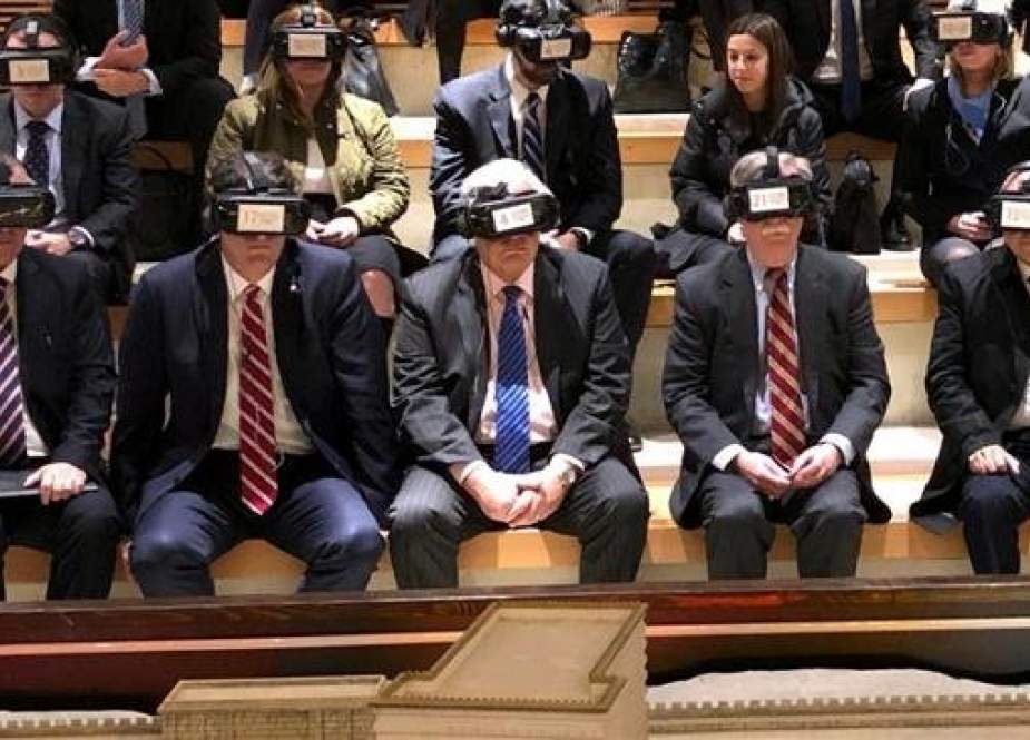 US National Security Advisor John Bolton (2nd row-2nd R) and others are seen wearing virtual reality goggles during a visit to the Western Wall in East Jerusalem al-Quds