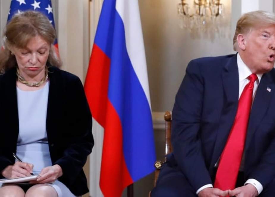 In this AFP file photo taken on July 16, 2018 US President Donald Trump, with interpreter Marina Gross, waits ahead of a meeting in Helsinki with Russian President Vladimir Putin.
