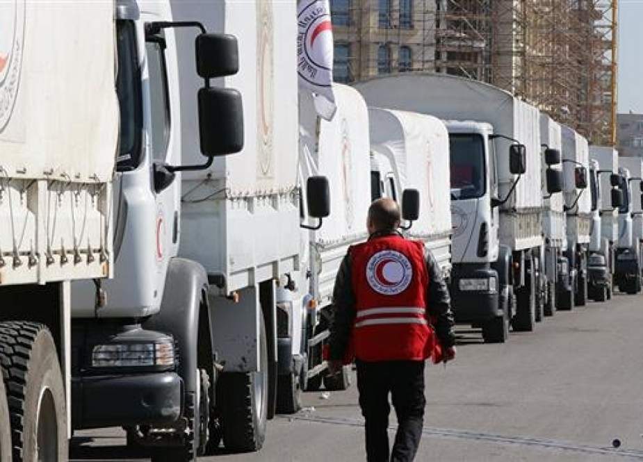 In this file picture, a Syrian Arab Red Crescent (SARC) convoy prepares to leave Damascus to the besieged areas of Madaya and Zabadani during an operation in coordination with the UN to deliver aid to thousands of besieged Syrians. (By AFP)