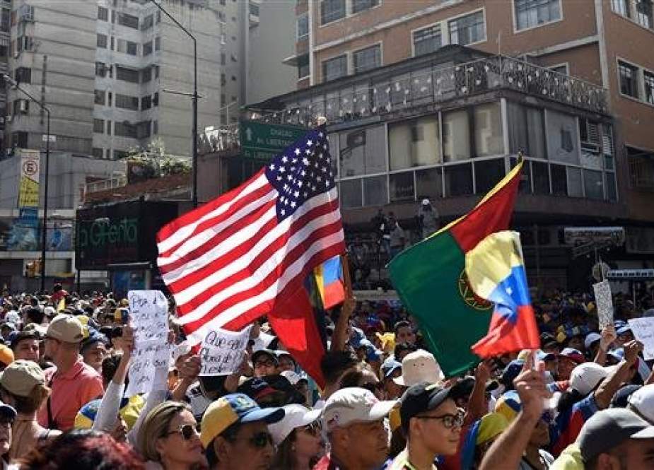 US flag is seen amid the crowd of supporters of Venezuelan opposition leader Juan Guaido in eastern Caracas.jpg