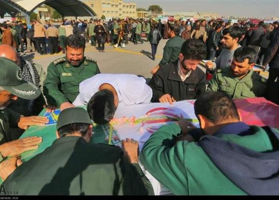 Photo of a group of IRGC forces mourning the martyrdom of their comrades as the bodies of those killed in a Feb. 13 attack on IRGC forces in Sistan and Baluchestan arrive in their hometown, Isfahan, on Feb. 15, 2019. (Photo by IRNA)