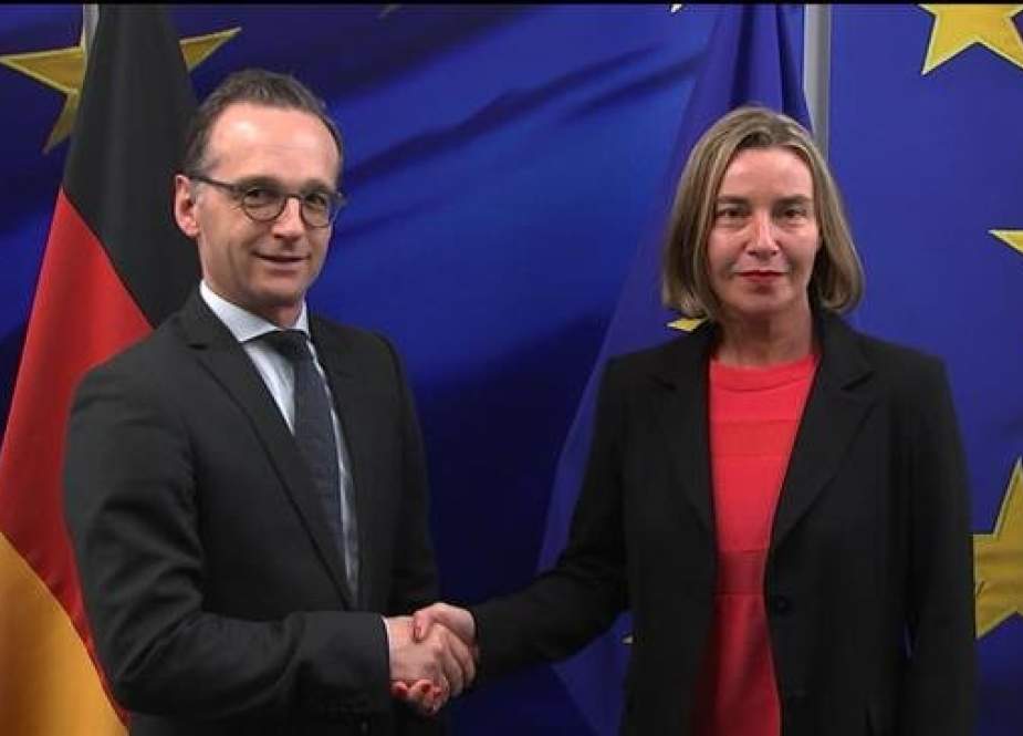 EU foreign policy chief Federica Mogherini (R) and German Foreign Minister Heiko Maas shake hands in Brussels in this April 13, 2018 file photo. (Photo by the European Commission)