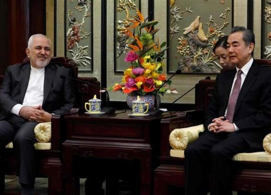 Iran’s Foreign Minister Mohammad Javad Zarif (L) and his Chinese counterpart, Wang Yi, hold talks at the Diaoyutai State Guesthouse in Beijing on February 19, 2019. (Photo by AFP)