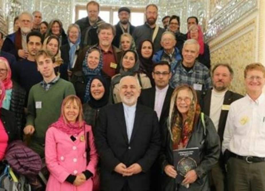 Iranian Foreign Minister Mohammad Javad Zarif (center, first line) poses for a picture with Code Pink activists in Tehran on March 25, 2019.