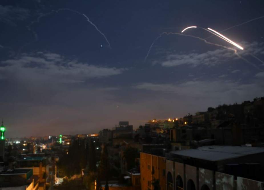 A file photo taken early on January 21, 2019 shows Syrian air defense batteries responding to Israeli missiles targeting Damascus. (Photo by AFP)