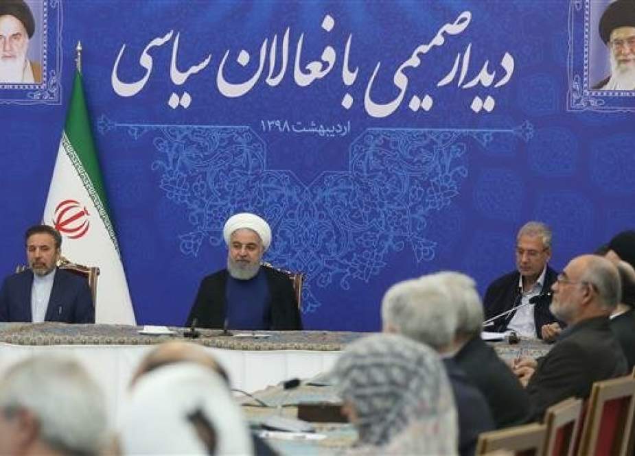 This photo released by the office of the Iranian President Hassan Rouhani shows him (C) listening to political activists during a meeting in Tehran on May 11, 2019.